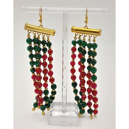 1283 - A substantial six row necklace with green and red jade highly polished beads in a geometric design, ... 