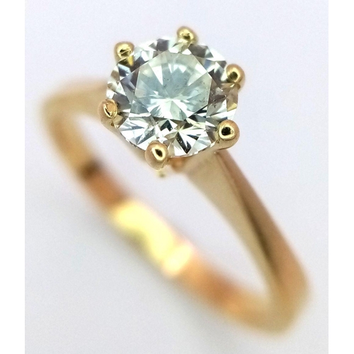 471 - An 18K Yellow Gold Diamond Solitaire Ring. A 0.75ct brilliant round cut diamond - SI1 clarity. Tinte... 