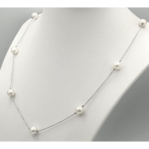 764 - An 18K White Gold Necklace with Nine Pearl Decoration. 7.4g total weight. Pearls, 7/8mm. 44cm length... 