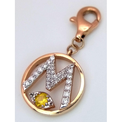 1148 - A 14K YELLOW GOLD DIAMOND SET INITIAL M CHARM 2.3G TOTAL WEIGHT, 2.8CM x 1.4CM. Ref: SC 8068