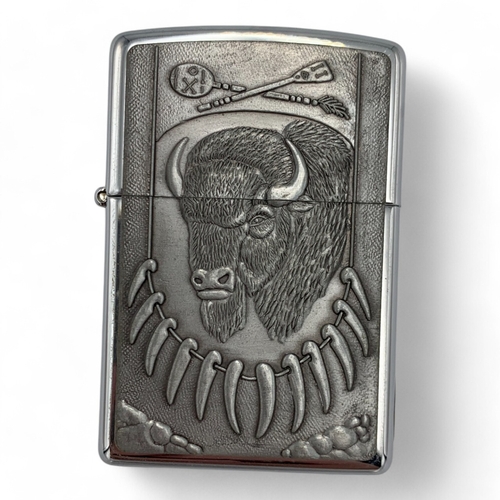 1142 - A rare vintage US Zippo Wild West Buffalo Head Lighter, comes with the original gold-tone metal tin.... 