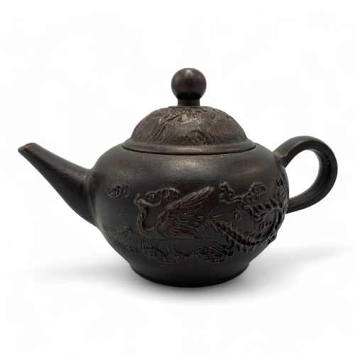 1331 - An antique Chinese Qing Dynasty Yixing Zisha Teapot. Brown bronze exterior with relief dragon and ph... 