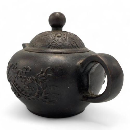 1331 - An antique Chinese Qing Dynasty Yixing Zisha Teapot. Brown bronze exterior with relief dragon and ph... 