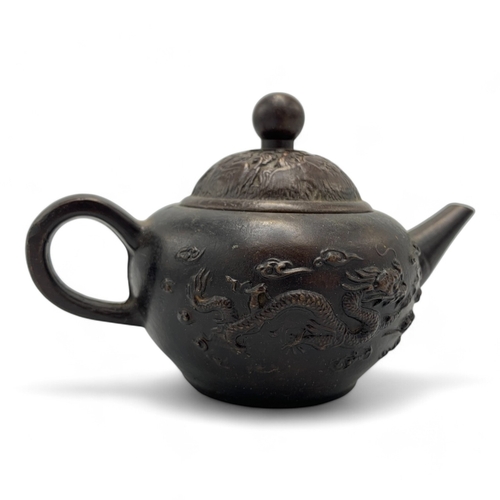 1331 - An antique Chinese Qing Dynasty Yixing Zisha Teapot. Brown bronze exterior with relief dragon and ph... 