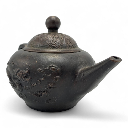 1331 - An antique Chinese Qing Dynasty Yixing Zisha Teapot. Brown bronze exterior with relief dragon and ph... 