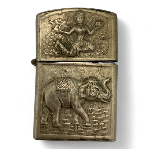 1345 - A Vintage Lighter with intricate engravings of Thai mythological figures and scenes.  Some signs of ... 