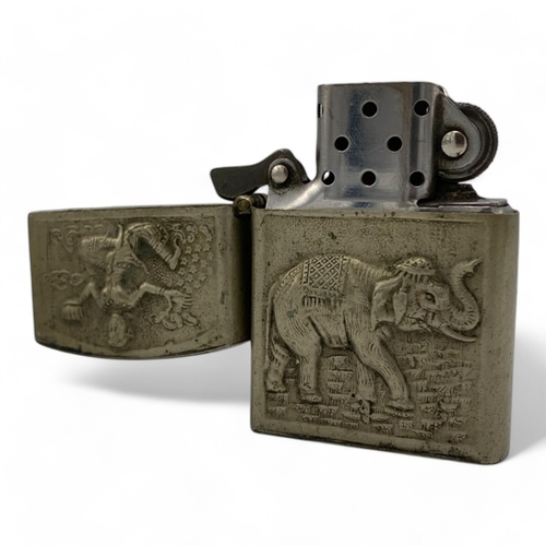 1345 - A Vintage Lighter with intricate engravings of Thai mythological figures and scenes.  Some signs of ... 