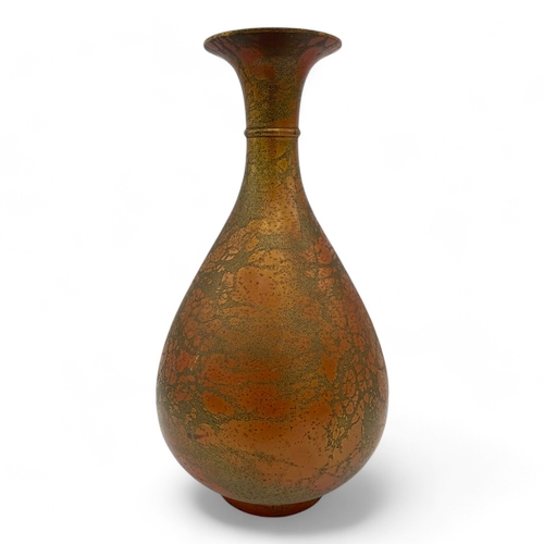 1562 - An antique Chinese Bronze Pipa-Shaped Flower Vase.
Bronze exterior with a patinated finish showcasin... 