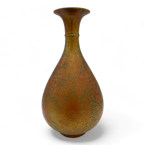 1562 - An antique Chinese Bronze Pipa-Shaped Flower Vase.
Bronze exterior with a patinated finish showcasin... 