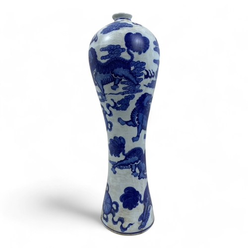 1044 - An antique Chinese Blue and White Porcelain Meiping Vase. Featuring mythical lions, cloud motifs, an... 