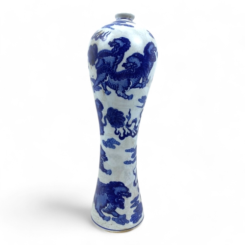 1044 - An antique Chinese Blue and White Porcelain Meiping Vase. Featuring mythical lions, cloud motifs, an... 