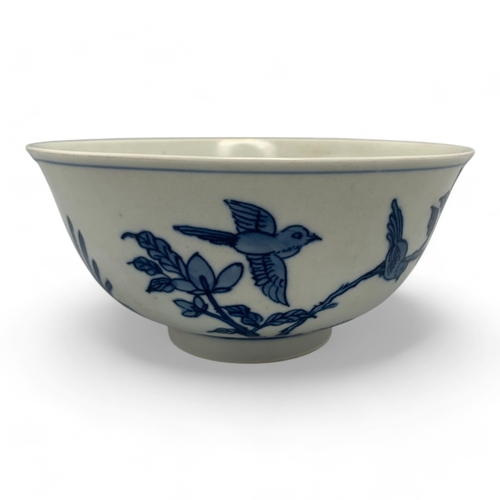 1058 - An antique Chinese Kangxi Blue and White Porcelain Bowl. Hand painted featuring bird and floral moti... 