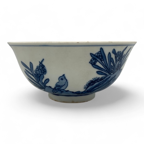 1058 - An antique Chinese Kangxi Blue and White Porcelain Bowl. Hand painted featuring bird and floral moti... 