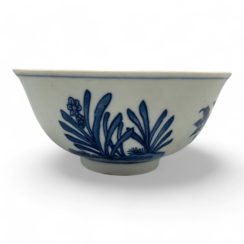 1058 - An antique Chinese Kangxi Blue and White Porcelain Bowl. Hand painted featuring bird and floral moti... 