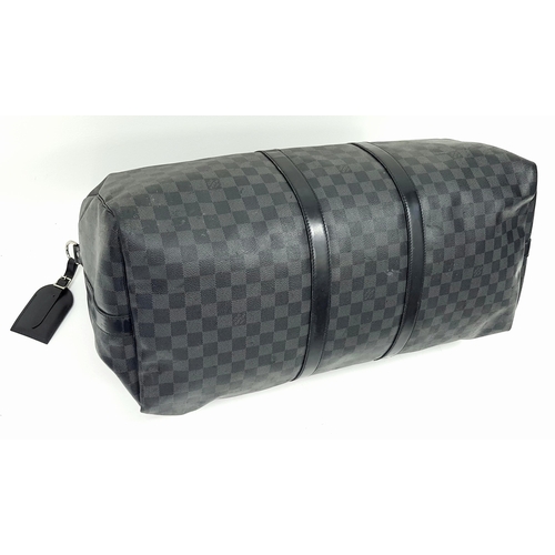 278 - A Louis Vuitton Damier Graphite Keepall 55 Travel Bag. Coated canvas exterior with leather trim, two... 