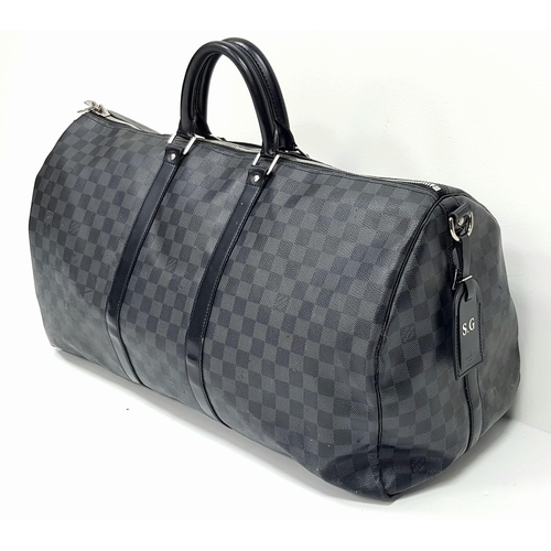 278 - A Louis Vuitton Damier Graphite Keepall 55 Travel Bag. Coated canvas exterior with leather trim, two... 