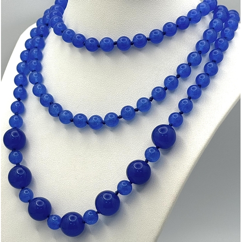 338 - A Rope Length Blue Jade Bead Necklace. 6mm-14mm beads. Can be worn in a variety of styles. 140cm.