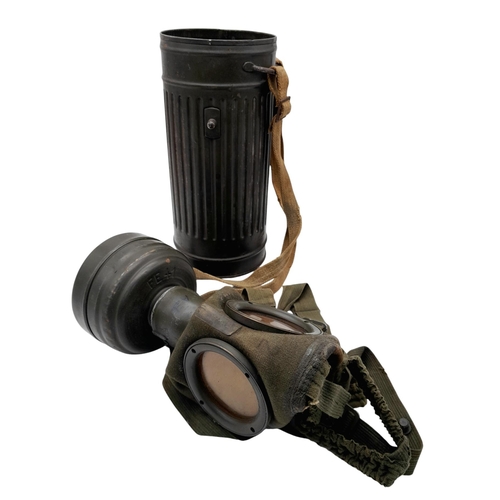 46 - A 1942 Dated German Gas Mask & Canister. Named to an SS Panzer Grenadier inside the lid.