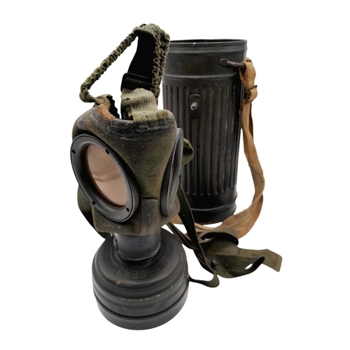 46 - A 1942 Dated German Gas Mask & Canister. Named to an SS Panzer Grenadier inside the lid.