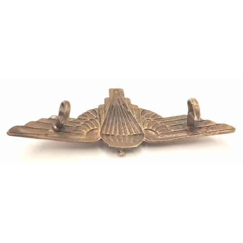 555 - A WW2 Free French in Exile Paratroopers Badge. Made from a cutdown British Cap Badge.