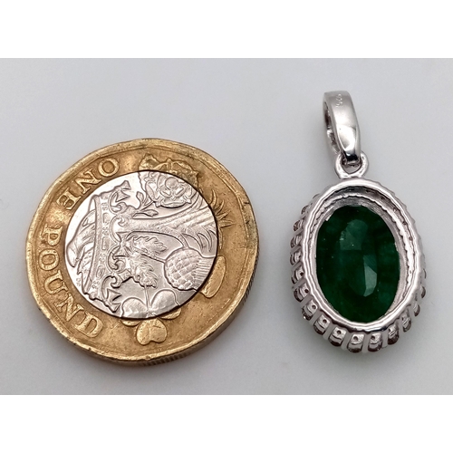 568 - A 5ct Emerald Pendant with Diamond Accents, Diamond weight approx 0.40ct. 2.5cm.