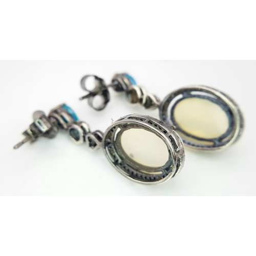 575 - A Pair of Moonstone Earrings with Diamond and Opal Accents. Set in 925 Silver. Moonstones - 6ctw. Ol... 