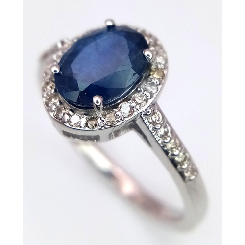 631 - A 1.5ct Oval Blue Sapphire Ring with 0.3ctw of Diamond Accents. Set in 925 Silver. Size N. CD-1685