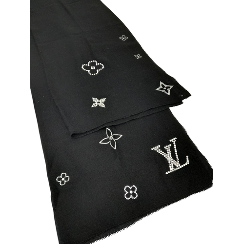 643 - Two Louis Vuitton Scarves. One is black soft cashmere features crystal embellishments forming Louis ... 