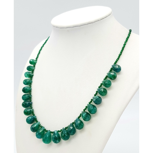 694 - An Emerald Pear Drop Necklace. 42cm. Silver clasp. CD-1667