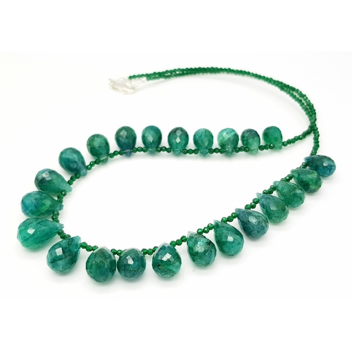 694 - An Emerald Pear Drop Necklace. 42cm. Silver clasp. CD-1667