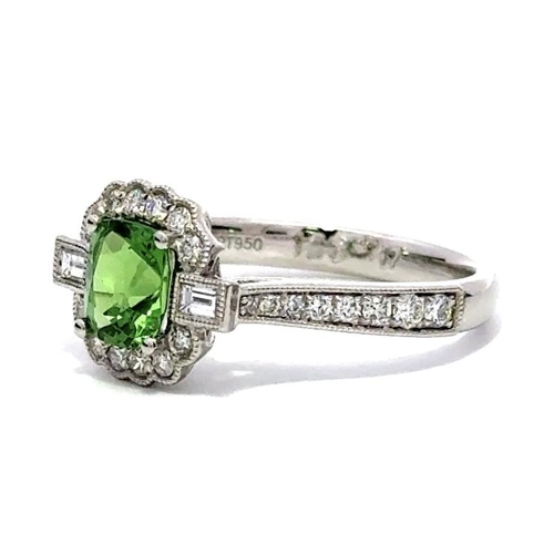 1201 - A PLATINUM CLUSTER RING FEATURING A 1.28CT CUSHION TSAVORITE AND 0.47CT ROUND AND BAGUETTE DIAMONDS,... 