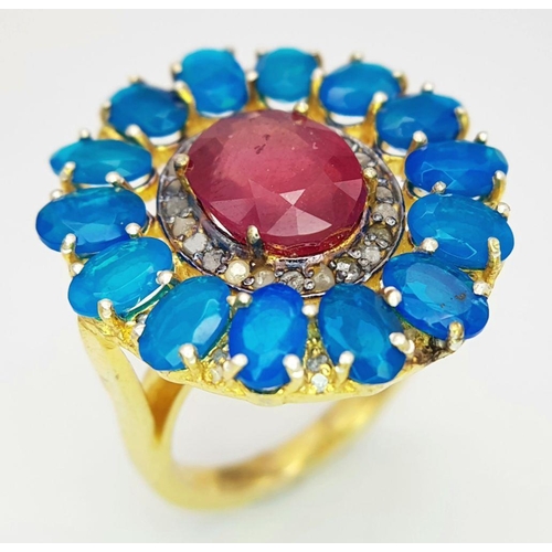 1557 - A gorgeous cocktail ring with a 7ct central ruby, surrounded by 4ct blue opals and 0.15ct diamonds, ... 