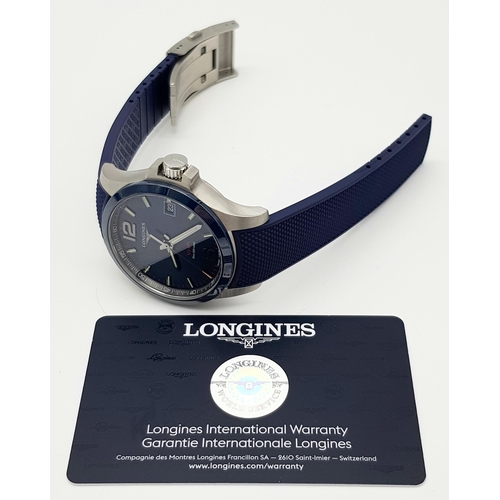 310 - A Longine Conquest V.H.P. Quartz Gents Watch. Blue rubber strap. Stainless steel case - 42mm. Blue d... 