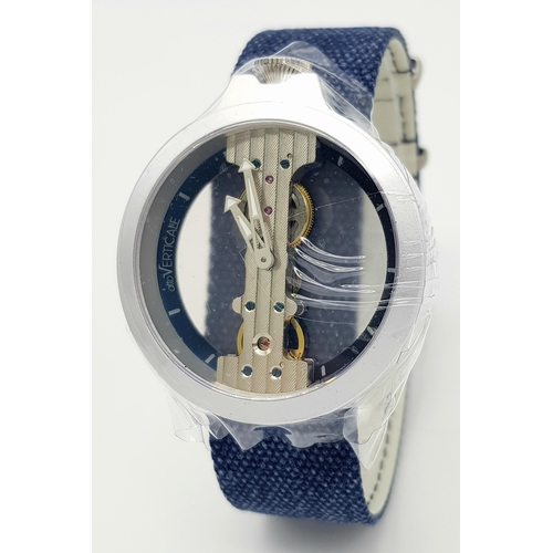 542 - A Verticale Mechanical Top Winder Gents Watch. Blue textile strap. Ceramic silver tone skeleton case... 