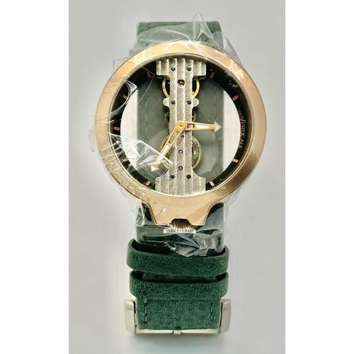 738 - A Verticale Mechanical Top Winder Gents Watch. Green leather strap. Ceramic gold tone skeleton case ... 