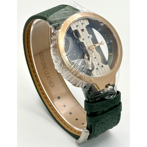 738 - A Verticale Mechanical Top Winder Gents Watch. Green leather strap. Ceramic gold tone skeleton case ... 