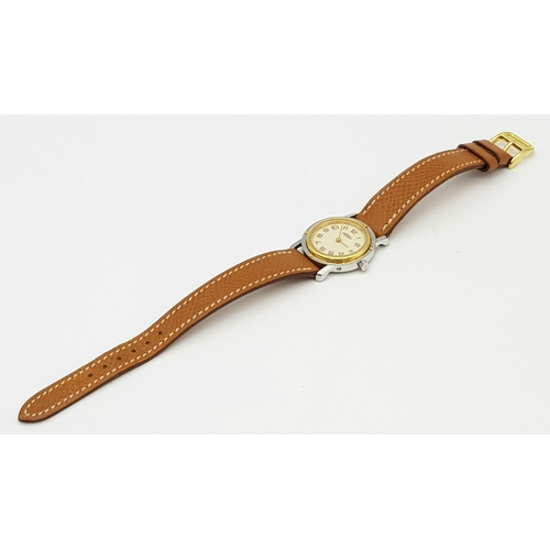 85 - An Hermes of Paris Quartz Ladies Watch. Brown leather strap. Two tone stainless steel case - 25mm. C... 