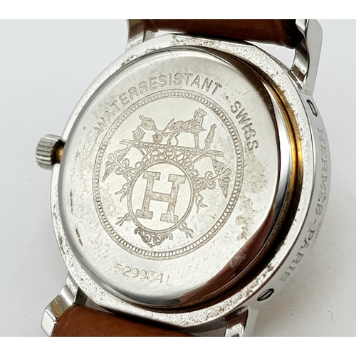 85 - An Hermes of Paris Quartz Ladies Watch. Brown leather strap. Two tone stainless steel case - 25mm. C... 