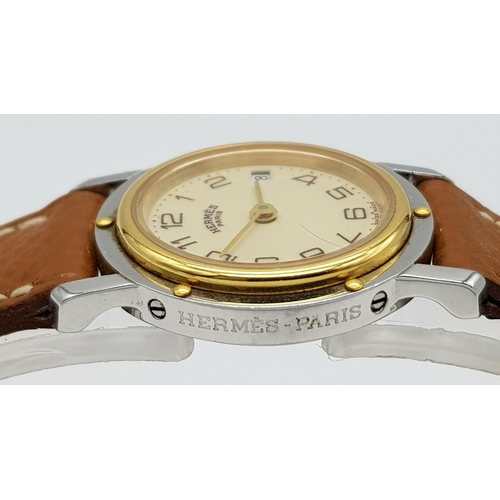 85 - An Hermes of Paris Quartz Ladies Watch. Brown leather strap. Two tone stainless steel case - 25mm. C... 