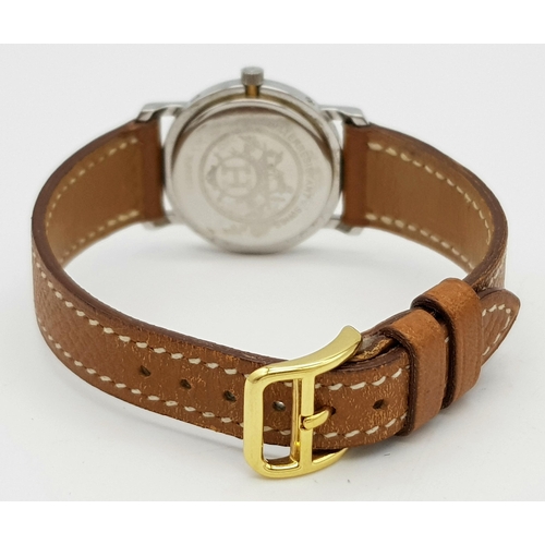 85 - An Hermes of Paris Quartz Ladies Watch. Brown leather strap. Two tone stainless steel case - 25mm. C... 