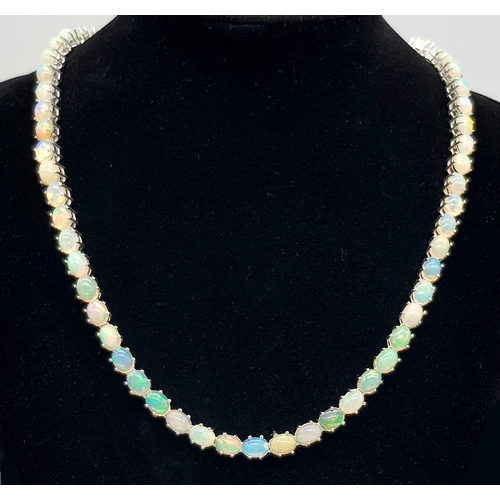 1318 - A 925 silver opal gemstone tennis necklace. Oval-cut opal stones. Total length: 46cm. Total weight: ... 