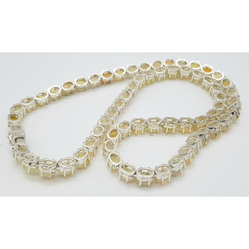 1318 - A 925 silver opal gemstone tennis necklace. Oval-cut opal stones. Total length: 46cm. Total weight: ... 