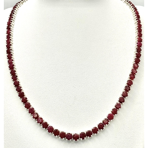 1382 - A 925 silver ruby gemstone tennis necklace. Round-cut ruby stones. Total length: 45.5cm. Total weigh... 