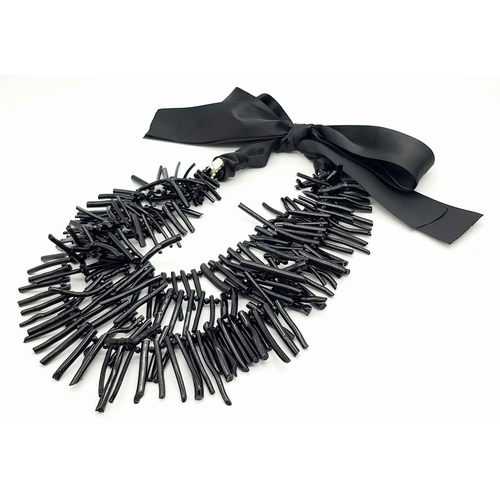 223 - A highly glamorous and rarely seen, three-strand, genuine black coral necklace presented in a vintag... 