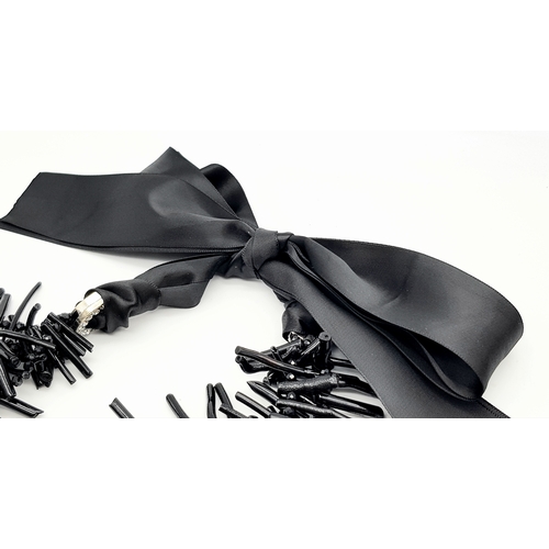 223 - A highly glamorous and rarely seen, three-strand, genuine black coral necklace presented in a vintag... 