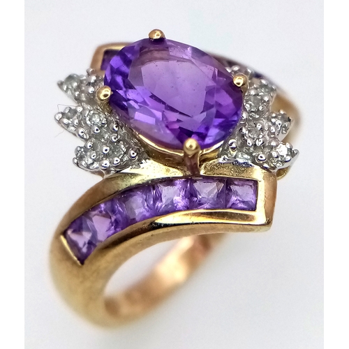 417 - A Hallmarked 2004 9 Carat Yellow Gold Amethyst and Diamond Art Deco Design Ring Size N. The Ring is ... 