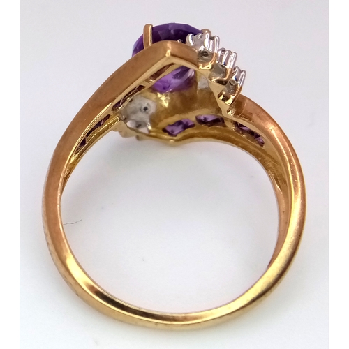 417 - A Hallmarked 2004 9 Carat Yellow Gold Amethyst and Diamond Art Deco Design Ring Size N. The Ring is ... 