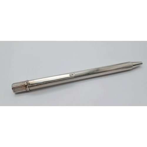 460 - A Vintage Cartier Steel Ballpoint Pen in its original box. Pen measures 12.3cm Length. Ink marks to ... 