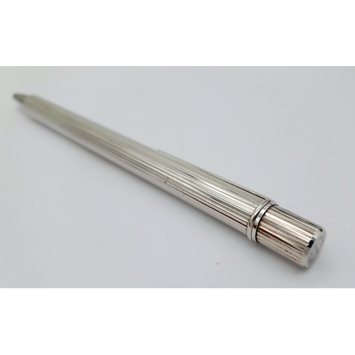 460 - A Vintage Cartier Steel Ballpoint Pen in its original box. Pen measures 12.3cm Length. Ink marks to ... 