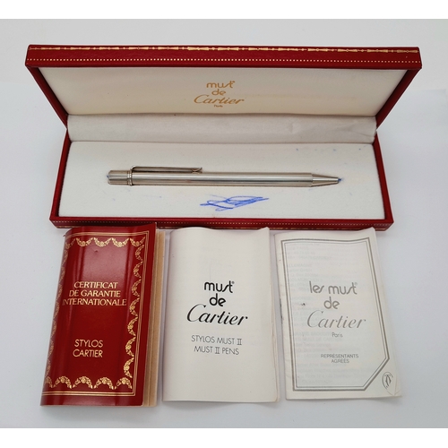 460 - A Vintage Cartier Steel Ballpoint Pen in its original box. Pen measures 12.3cm Length. Ink marks to ... 